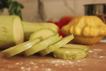 Sliced courgettes on a wooden board