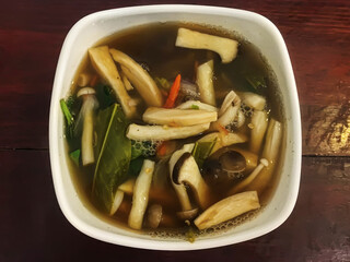 Thai Mushroom Soup on a wooden table.