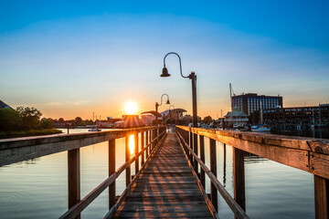 View of Hampton Virginia downtown waterfront district seen at sunset under colorful sky - obrazy, fototapety, plakaty