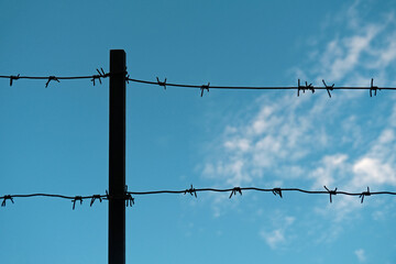 metal barbed wire on sky
