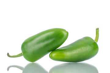 Two green spicy pepper pods, close-up, isolated on white.