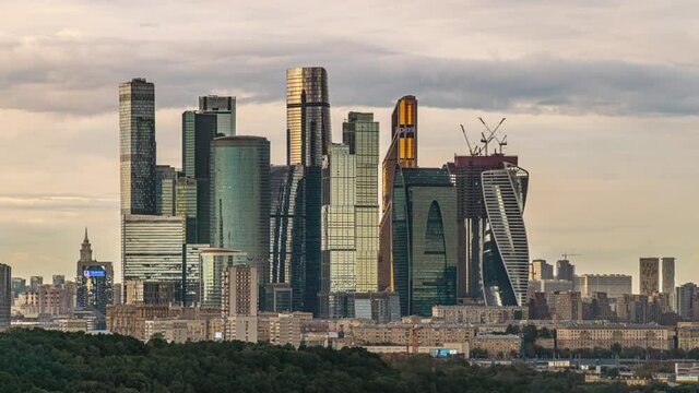 Skyscrapers of Moscow City against the background of fast moving clouds.