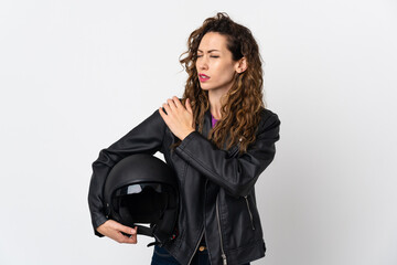 Young caucasian woman holding a motorcycle helmet suffering from pain in shoulder for having made an effort