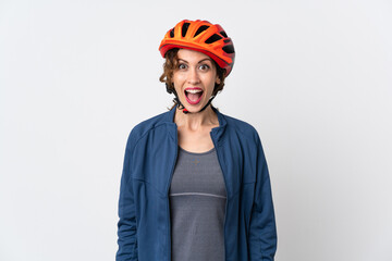 Young cyclist woman isolated on white background with surprise facial expression