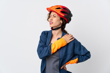 Young cyclist woman isolated on white background suffering from pain in shoulder for having made an effort