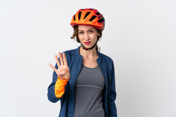 Young cyclist woman isolated on white background happy and counting four with fingers