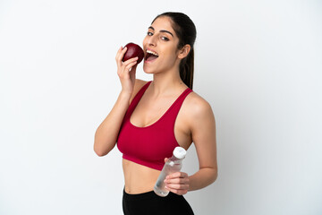 Young caucasian woman isolated on white background with an apple and with a bottle of water