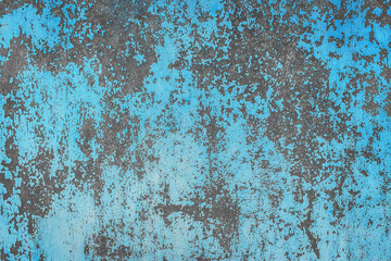 Old blue peeling paint dirty concrete wall texture with abstract grunge pattern cement background
