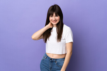 Young Ukrainian woman isolated on purple background laughing