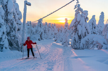 Woman cross country skiing in Lapland in Finland