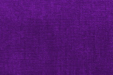 Purple velvet fabric texture used as background. Empty soft and smooth textile material.