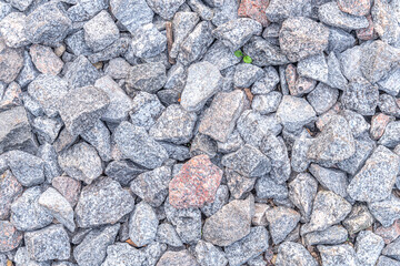 abstract background of gravel pebbles on the road close up