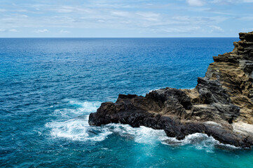 Rocky Seashore During the Day with Waves