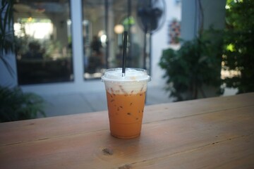 Thai tea milk  in a cup at coffee shop - 456993155