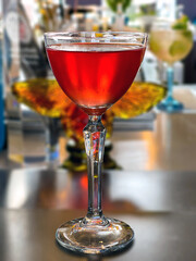 Gin cocktail in a tall glass on a bar