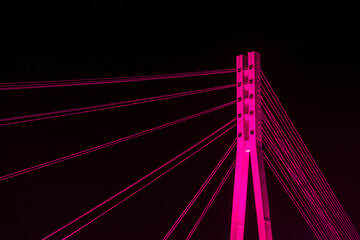 Bridge of lovers with purple illumination in Tyumen. Close up