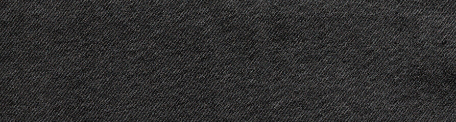 Fototapeta premium texture of black jeans denim fabric background 