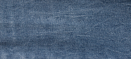 Naklejka premium texture of blue jeans denim fabric background 