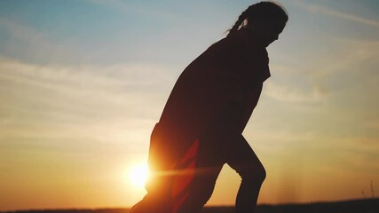 superhero kid run in the park. happy family play kid dream concept. happy child girl silhouette a raincoat run in park nature. happy family childhood concept. superhero kid run fun running at sunset