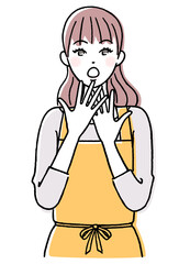 エプロン姿で驚く女性