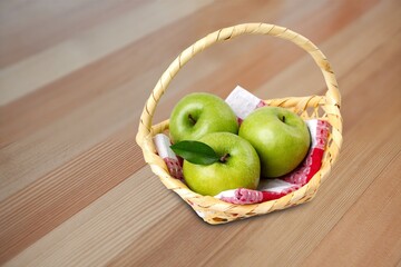 Fresh ripe tasty apples on wooden desk