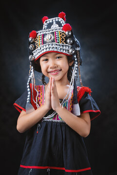 A hill tribe girl is showing hospitality by paying homage.