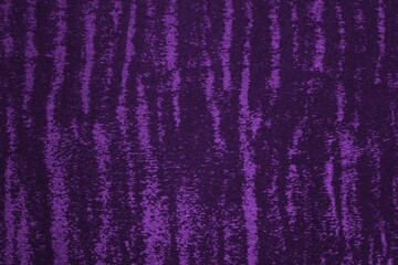Purple velvet fabric texture used as background. Empty soft and smooth textile material.