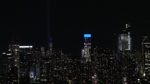 911 lights and the freedom tower on the top of Manhattan skyline
