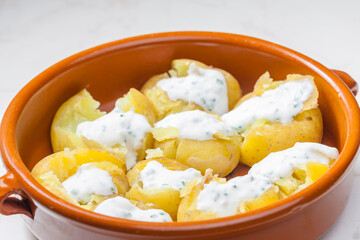 baked potatoes with yoghurt sauce and chive