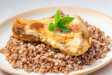 fried carp with bulgur and mint