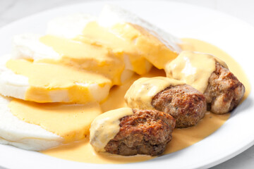 minced meat ball with creamy sauce and dumplings