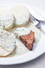 beef meat with dill sauce and dumplings