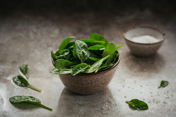 Leaves of fresh baby spinach in a Bowl.