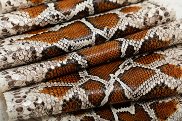 spotted brown colored natural python genuine leather	
