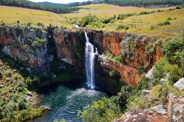 Berlin Falls Waterfall in Mpumalanga South Africa where a stream of water drops cliff into a lake