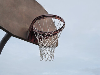 Basketball rim on a cloudy day
