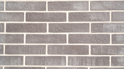 Brown brick wall background. Gray clinker brick wall