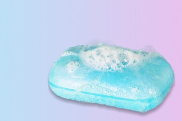 Face cleansing mousse sample. Foam bubbles on nude background.