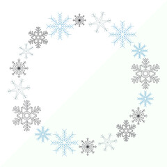 Winter theme frame made of blue, grey and black snowflakes on grey and white background. Winter, seasonal. Copy space.