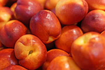 Pile of organic nectarines in supermarket.