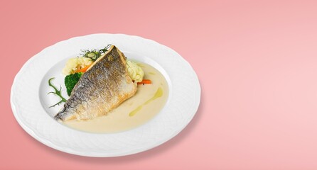 Traditional food tasty fish with vegetables on a plate