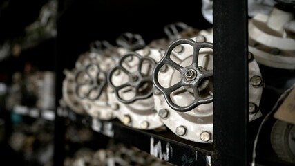 Heavy industry. Painting of a metal gate. Safety valves after painting at the factory. The process...