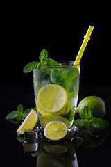 Refreshing summer alcoholic cocktail mojito with ice, fresh mint and lime