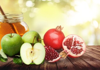 Apples, pomegranates and honey. Happy Rosh Hashanah. Traditional religious Jewish holiday New Year.