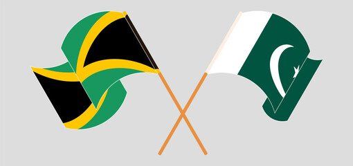 Crossed and waving flags of Jamaica and Pakistan