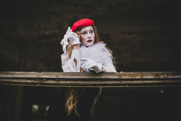 The girl with makeup of the mime. improvisation. Suit for Halloween. mime shows different emotions....