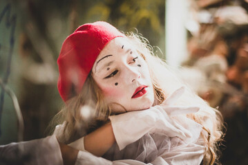 The girl with makeup of the mime. improvisation. Suit for Halloween. mime shows different emotions....