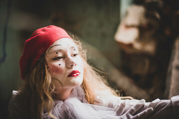 The girl with makeup of the mime. improvisation. Suit for Halloween. mime shows different emotions....
