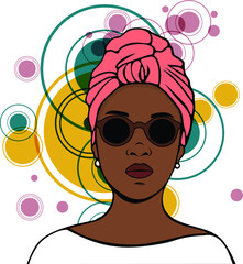 Portrait of strong black woman with a turban and sunglasses.