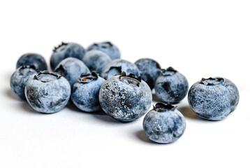 a lot of blueberries on a white background